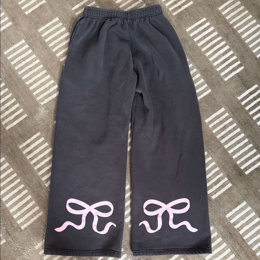 Edikted Gray wide leg sweatpants with cute pink bows on the back of each leg.